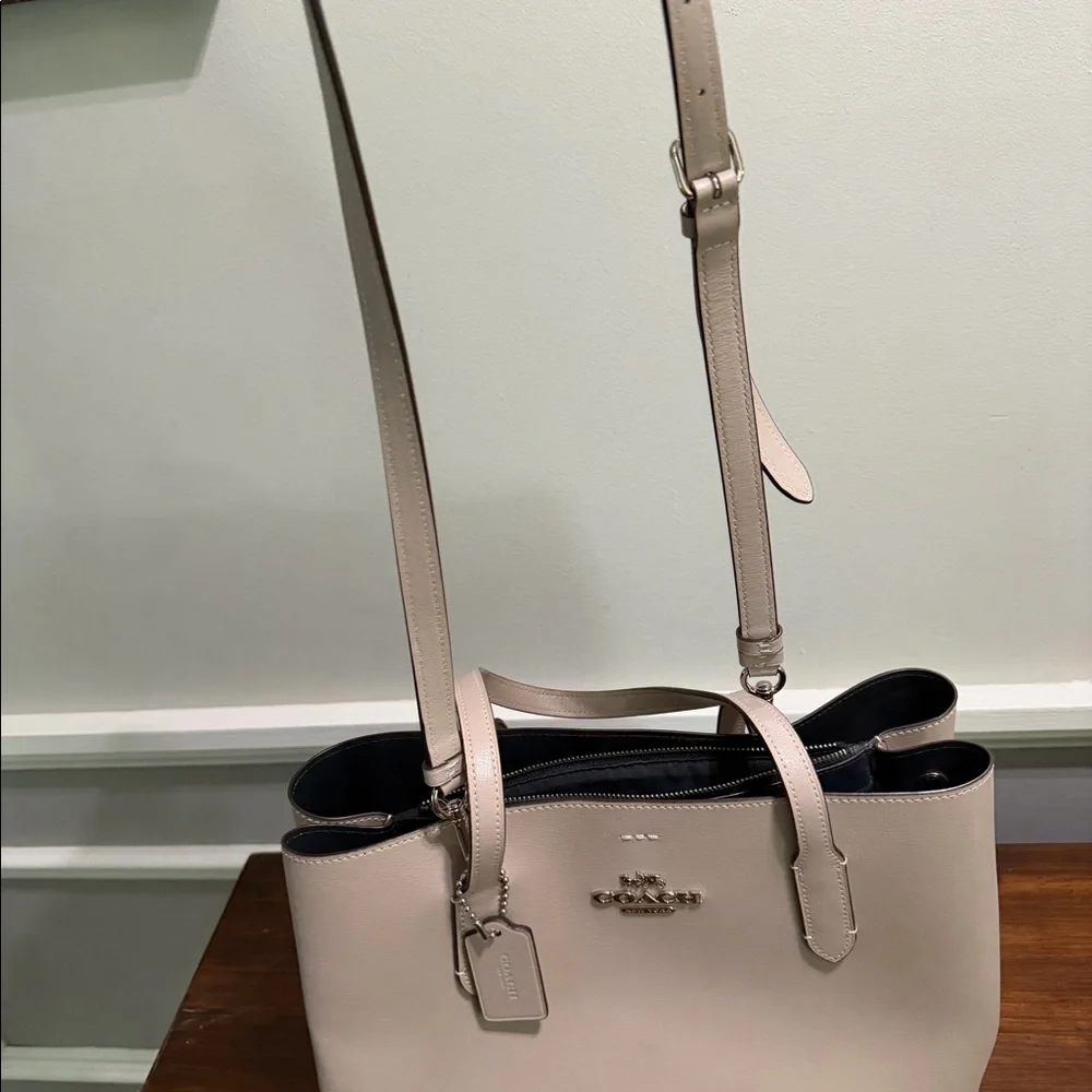 Large Coach handbag.  Purple/ grey color